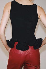 Top en maille à bas ondulé