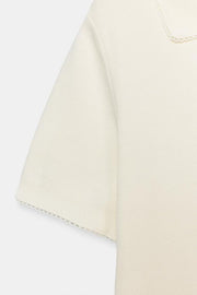 Polo en maille à dentelle contrastée