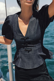 Top peplum à brandebourgs