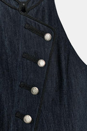 Gilet dos-nu à passepoils contrastés