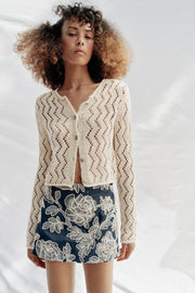 Veste en maille ajourée zigzag