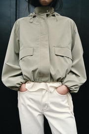 Blouson enduite à capuche