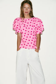 Top à pois à manches bouffantes