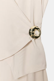 Combinaison à application dorée