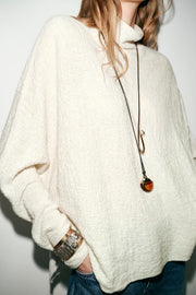 Pull effet cape en maille