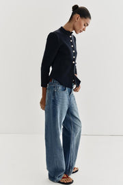 Veste en maille peplum à bouton doré