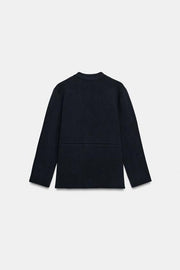 Veste en maille peplum à bouton doré