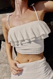 Top en maille à volants