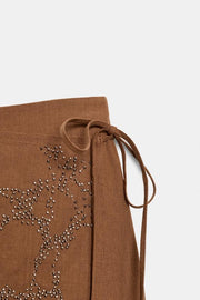 Jupe-culotte à lien noué et perles
