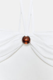 Top bandeau en maille à détail boule