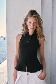 Top peplum à brandebourgs