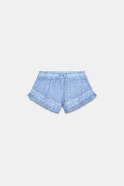 Short effet délavé à broderies ajourées