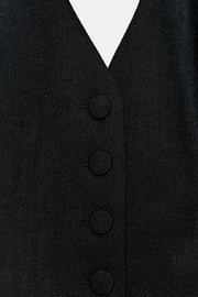 Top façon gilet à encolure dos-nu à bouton recouvert