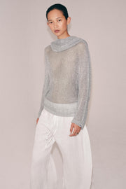Pull en maille à fil métallisé