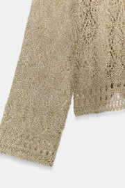 Pull en maille pointelle à fil métallisé