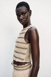 Top façon gilet à coutures contrastées